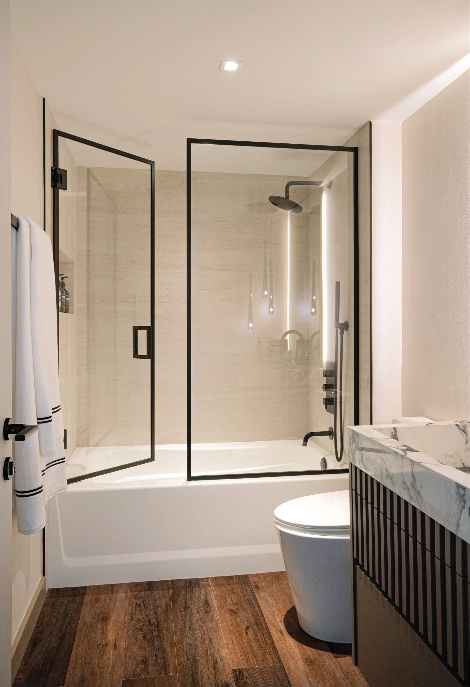 Casa Sienna — Glass shower and stone bathroom finishes