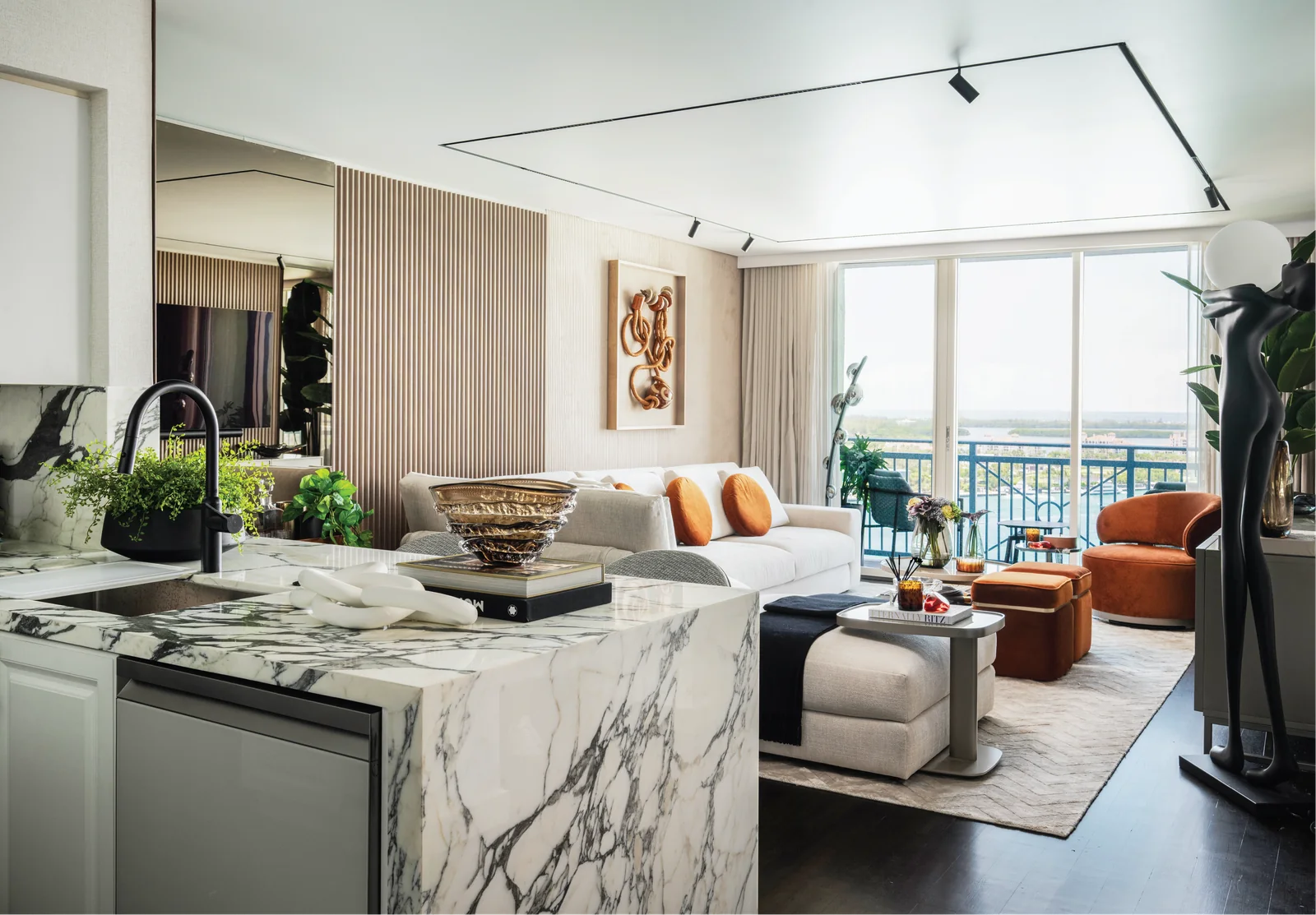 Casa Sienna — Open-plan living space with dark wood and marble