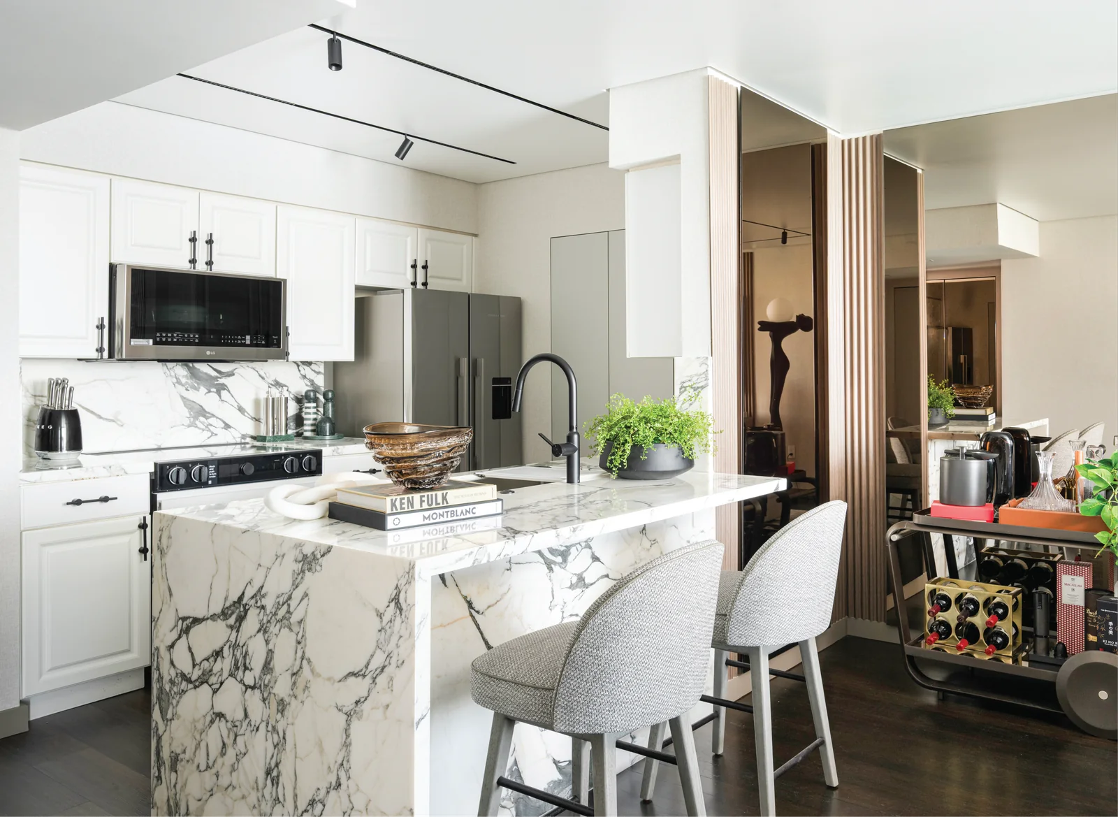 Casa Sienna — Kitchen island with natural stone and custom cabinetry